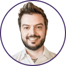 Smiling man with short, styled hair and beard, wearing a light-colored collared shirt, shown in a circular frame with a white background. Ideal for Deloitte or Cyber iCON 2024 professional profiles.